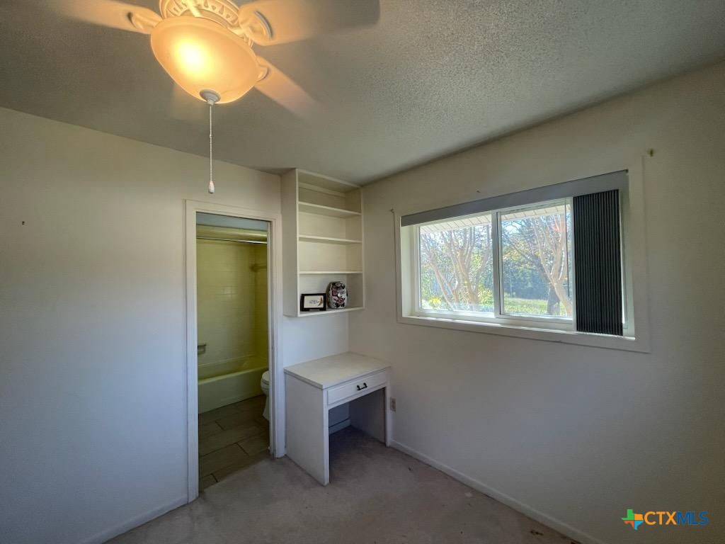 104 Skipcha Trail Lampasas, TX 76550 - Photo 26 of 34 a room with window and chandelier fan