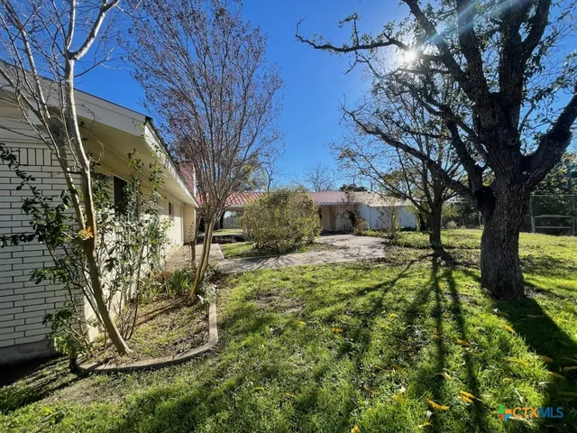 a backyard of a house with lots of green space