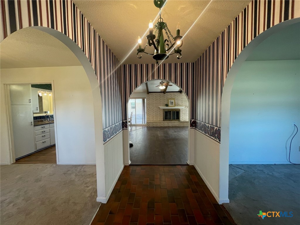 104 Skipcha Trail Lampasas, TX 76550 - Photo 7 of 34 a view of entryway and hall with wooden floor