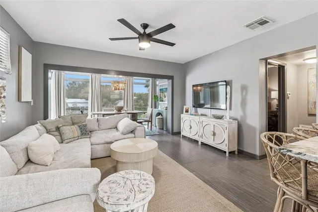 a view of a balcony with floor to ceiling window and wooden fence