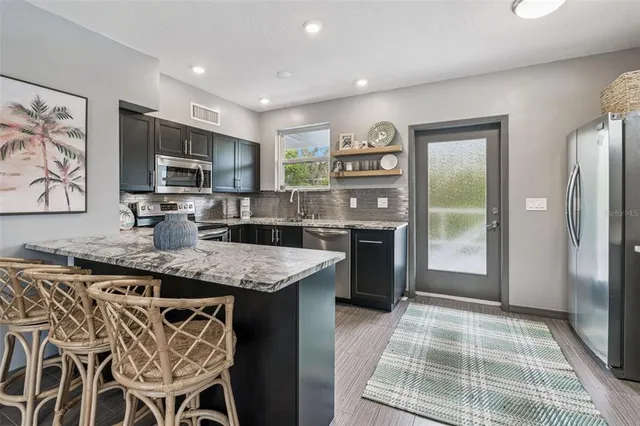 a view of a dining room with furniture window and outside view
