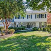 a view of a house with a yard patio and swimming pool