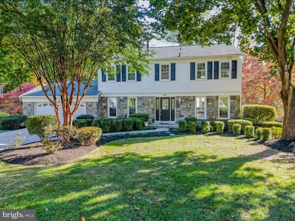 a view of a house with a yard patio and swimming pool