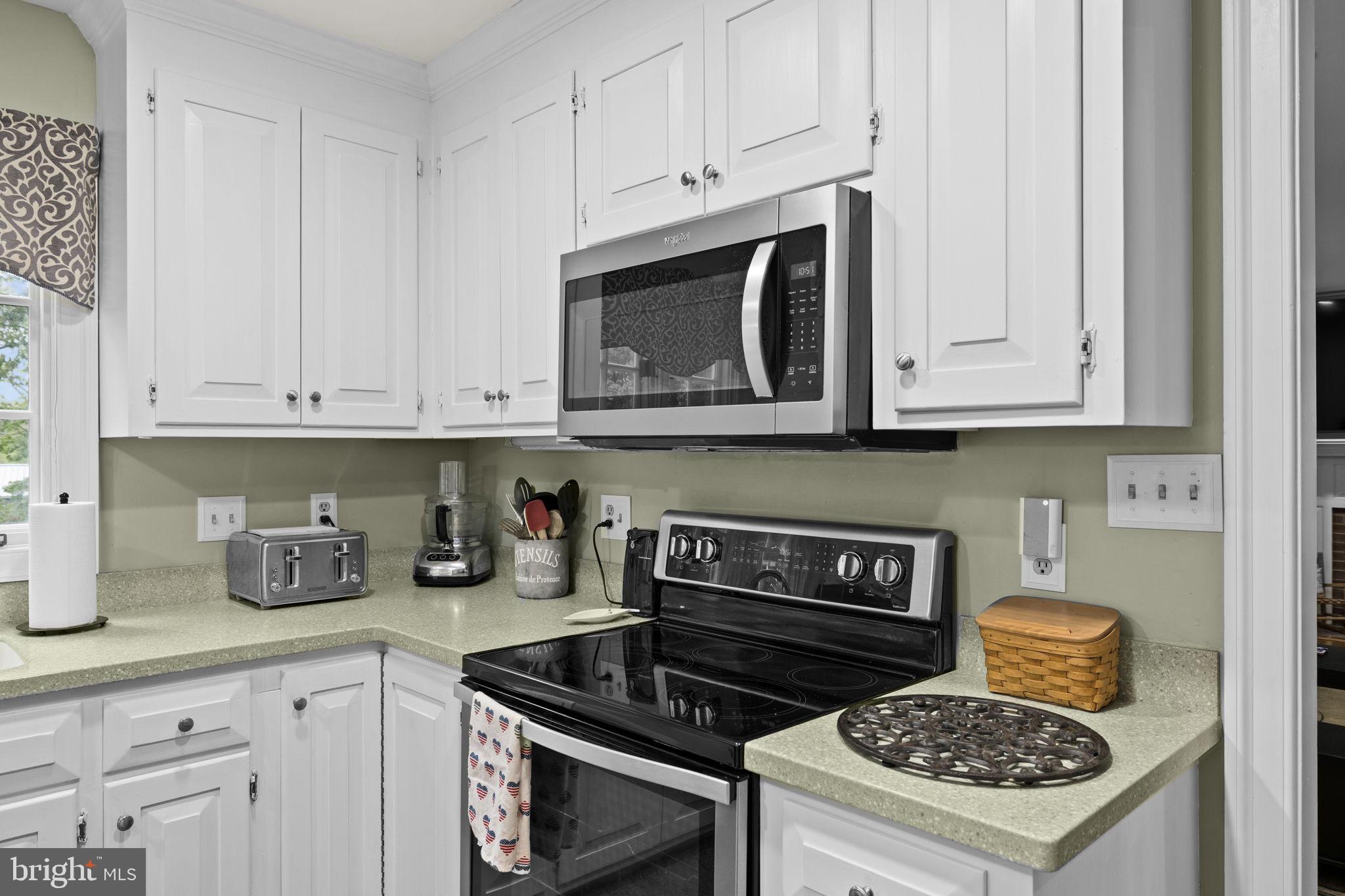 1942 Bibb Store Road Louisa, VA 23093 - Photo 14 of 61 a kitchen with appliances a stove and cabinets