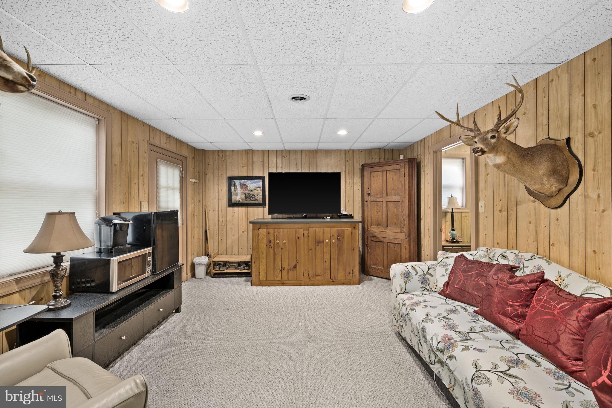 1942 Bibb Store Road Louisa, VA 23093 - Photo 33 of 61 a living room with furniture and a flat screen tv