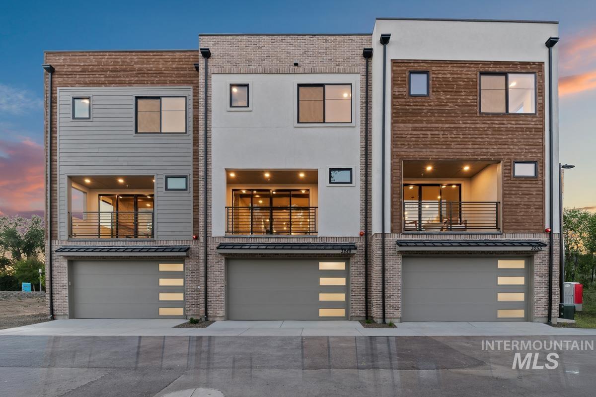 3255 West Moore Street Boise, ID 83702 - Photo 35 of 44 Back of house with a balcony, a garage, and driveway