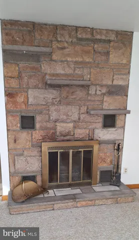 a living room with a fireplace