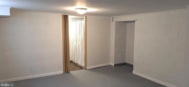 a bathroom with a shower and a sink