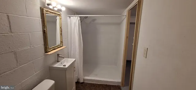 a bathroom with a toilet and a sink