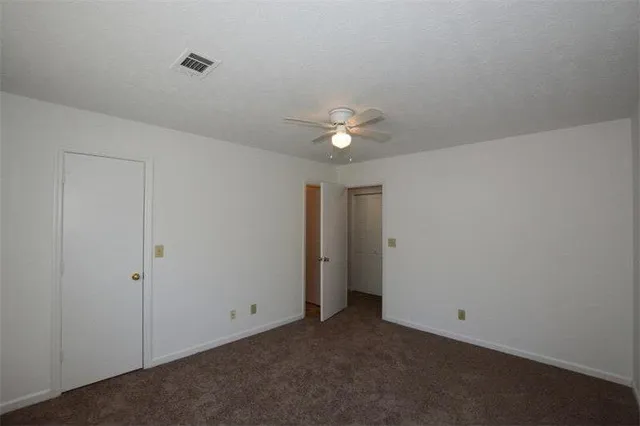 a bathroom with a sink toilet vanity and bathtub