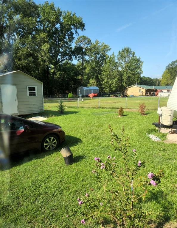 80 West G Sorsby Road, Unit W Texarkana, TX 75501 - Photo 5 of 12 a view of a backyard with a garden and entertaining space