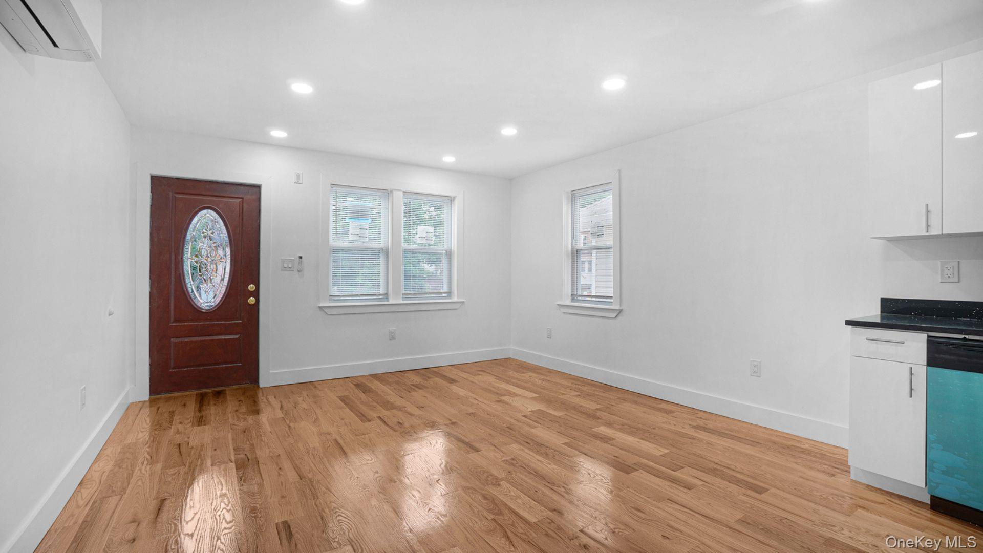 3968 Duryea Avenue Bronx, NY 10466 - Photo 12 of 30 Entrance foyer with light wood finished floors, a wall mounted AC, and recessed lighting