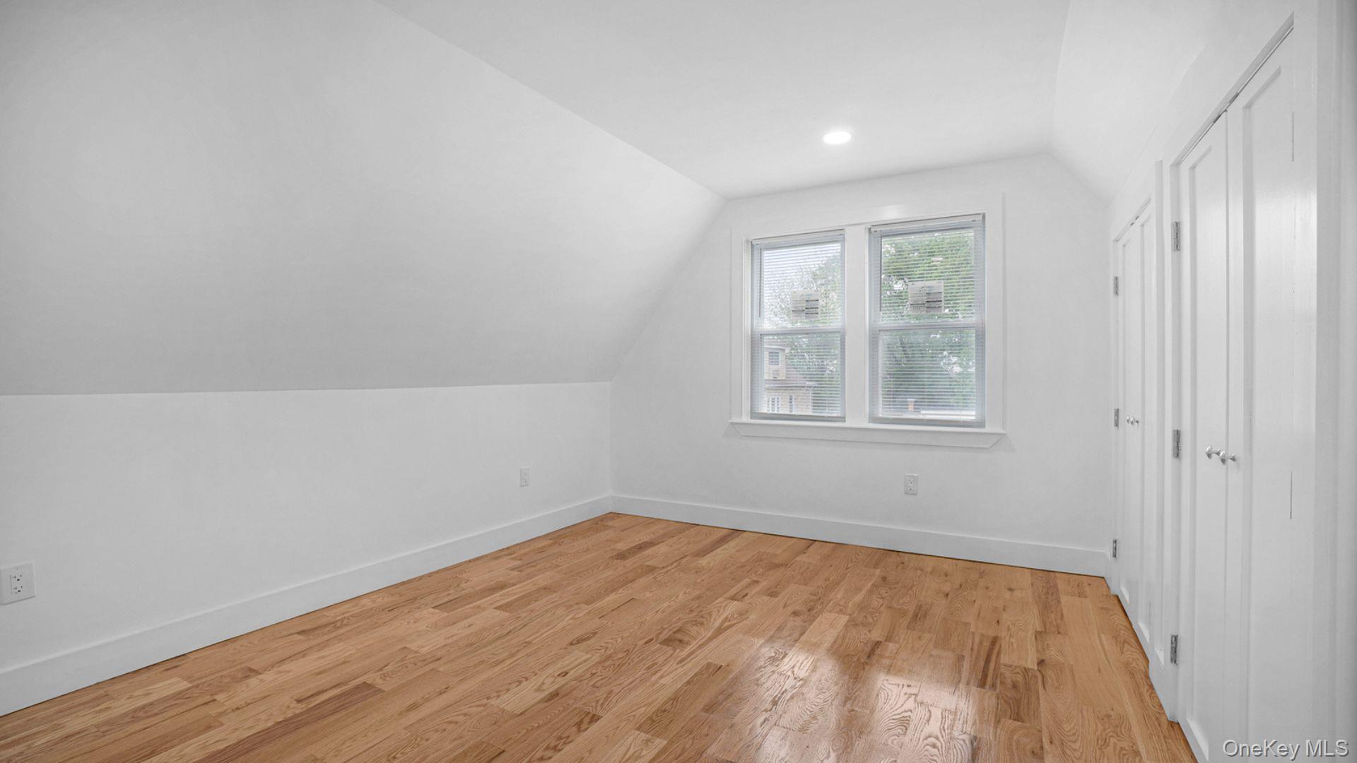 3968 Duryea Avenue Bronx, NY 10466 - Photo 21 of 30 Additional living space with lofted ceiling, light wood-style floors, and recessed lighting