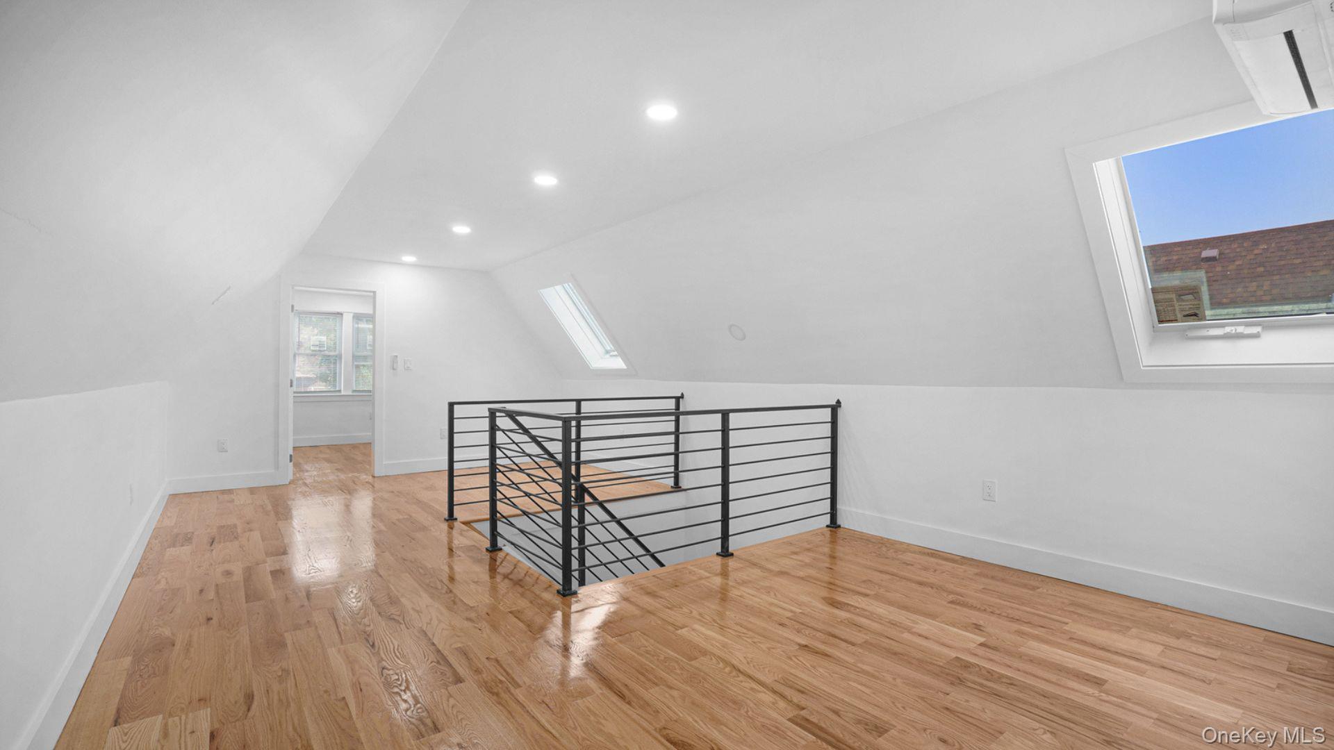 3968 Duryea Avenue Bronx, NY 10466 - Photo 22 of 30 Additional living space with a skylight, light wood-style flooring, lofted ceiling, and recessed lighting
