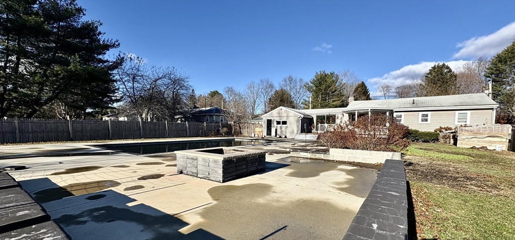 5 Wennerberg Road Middleton, MA 01949 - Photo 7 of 7 a view of a patio with couches chairs and wooden floor