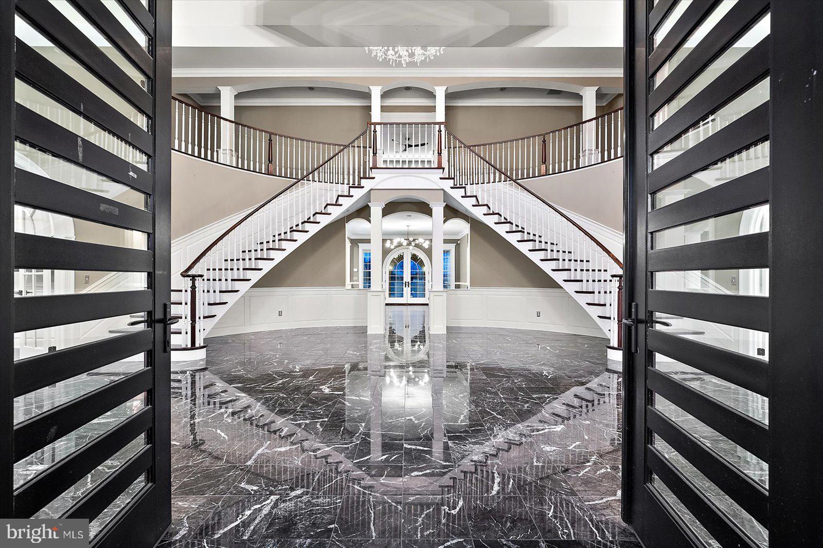 4218 Harmony Road Preston, MD 21655 - Photo 17 of 127 Stunning entry with sweeping dual curved staircase