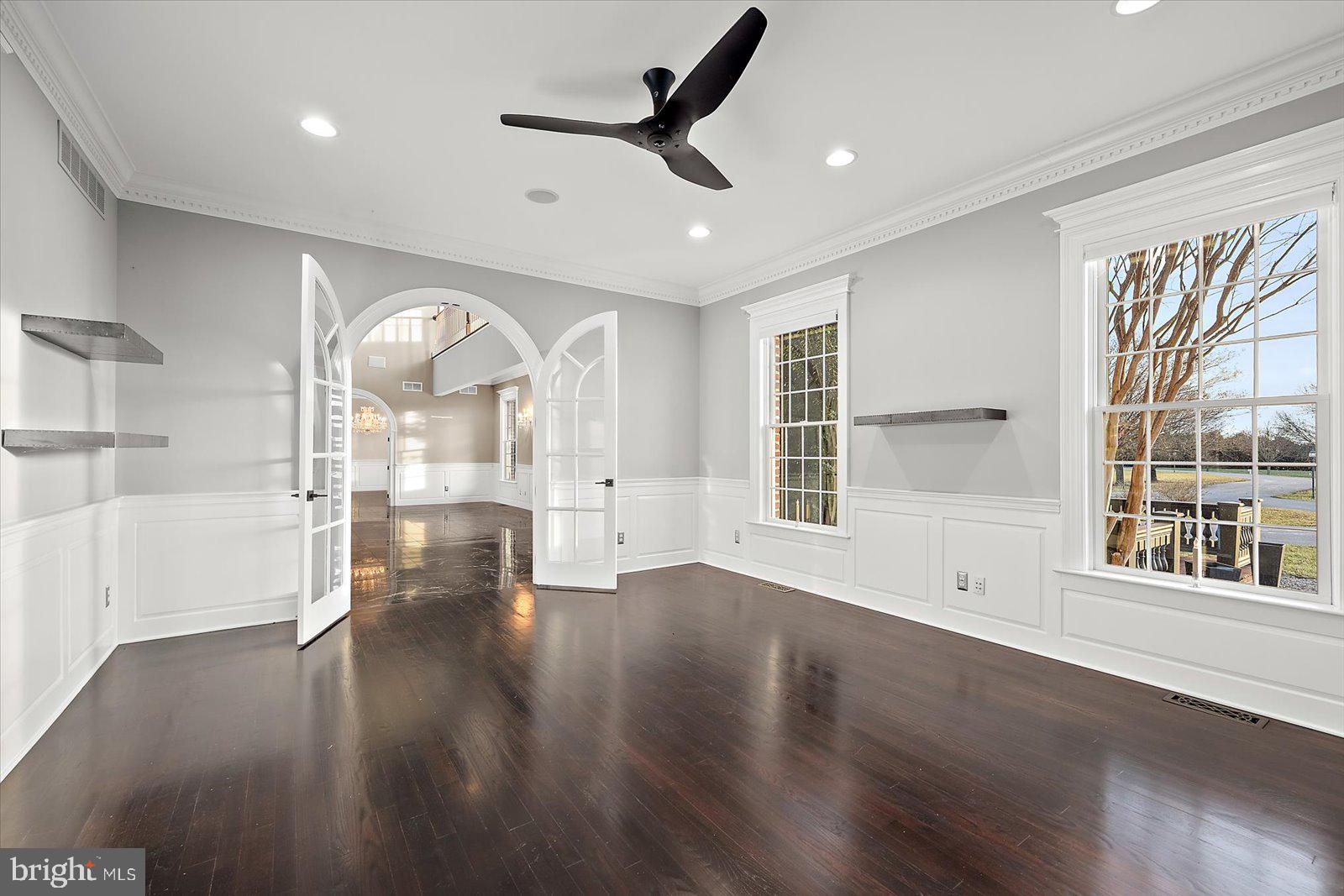 4218 Harmony Road Preston, MD 21655 - Photo 22 of 127 a view of empty room with wooden floor and fan