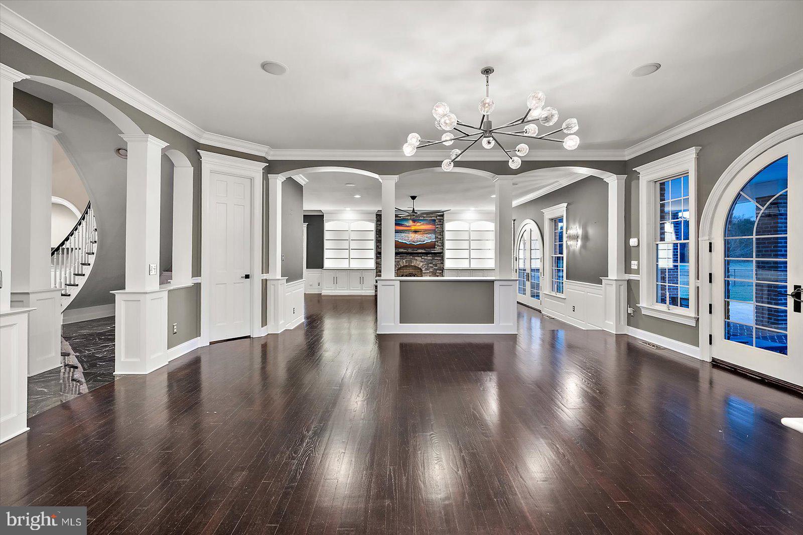 4218 Harmony Road Preston, MD 21655 - Photo 23 of 127 a view of a big room with wooden floor and a kitchen
