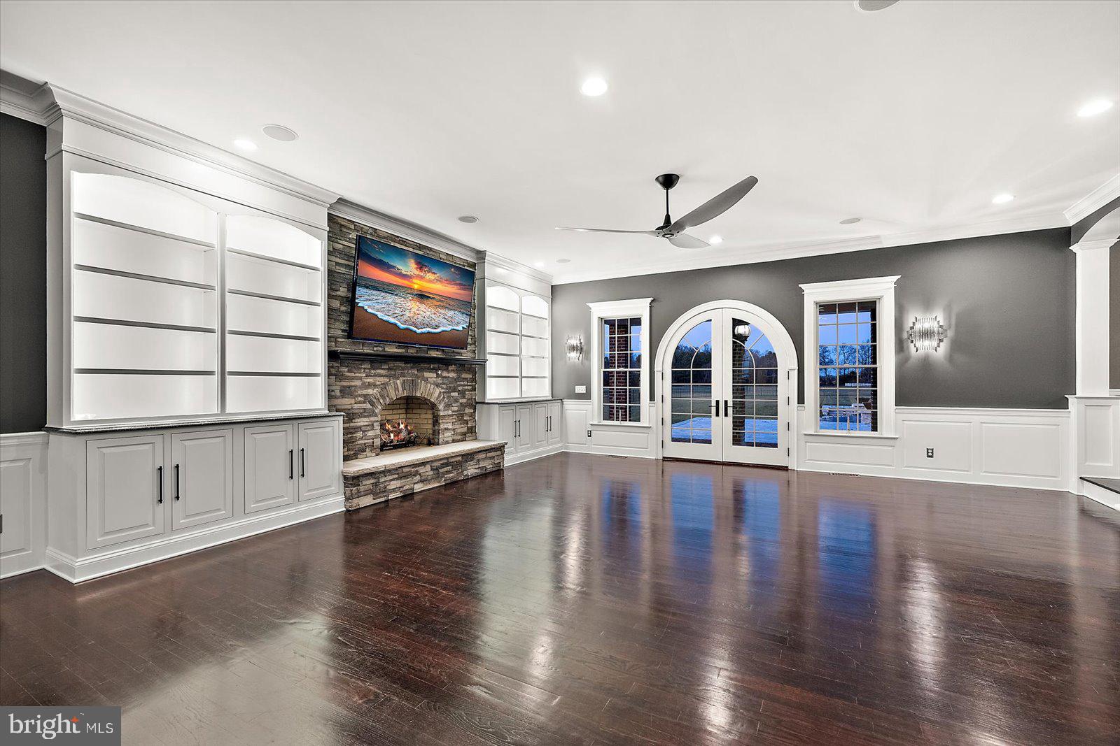 4218 Harmony Road Preston, MD 21655 - Photo 26 of 127 a view of an empty room with wooden floor fireplace and a window