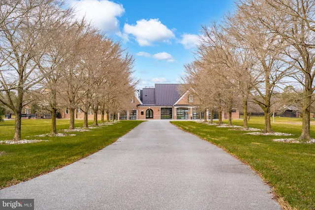 an aerial view of a house with outdoor space lake view