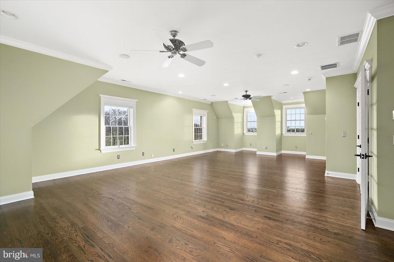 4218 Harmony Road Preston, MD 21655 - Photo 81 of 127 a view of empty room with wooden floor and fan