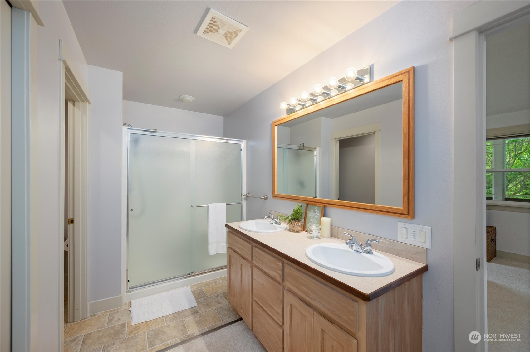 3703 Fielding Avenue Bellingham, WA 98229 - Photo 20 of 40 a bathroom with a sink mirror and a shower