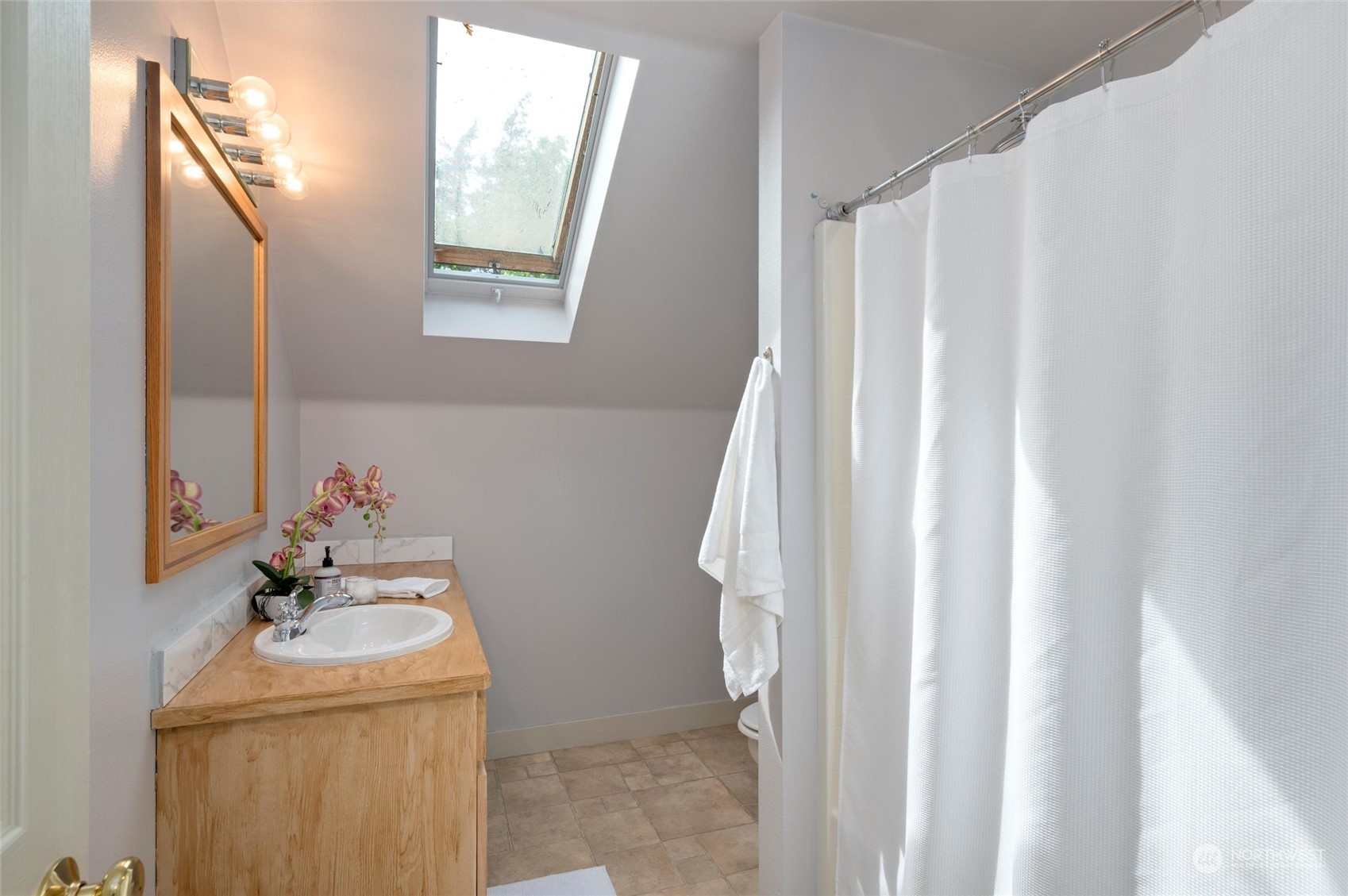 3703 Fielding Avenue Bellingham, WA 98229 - Photo 26 of 40 a bathroom with a sink a vanity and a mirror