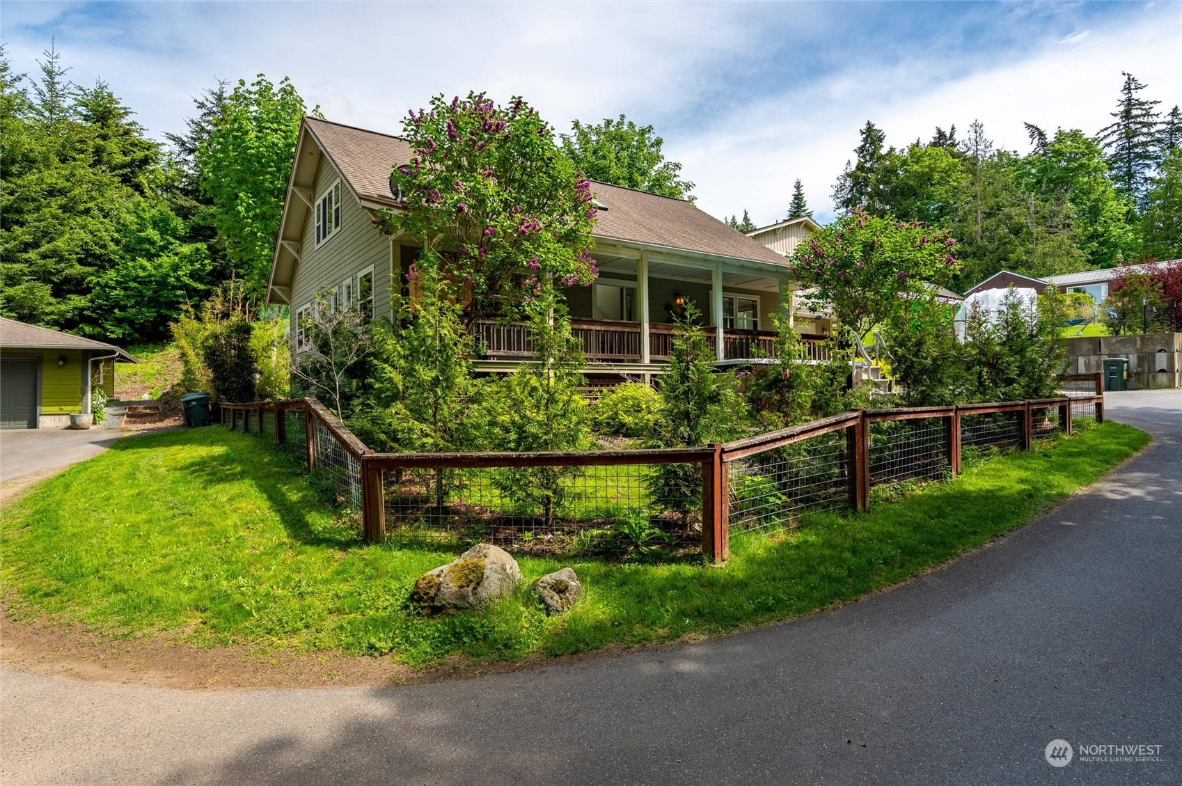 3703 Fielding Avenue Bellingham, WA 98229 - Photo 32 of 40 a view of a garden with a bench and trees