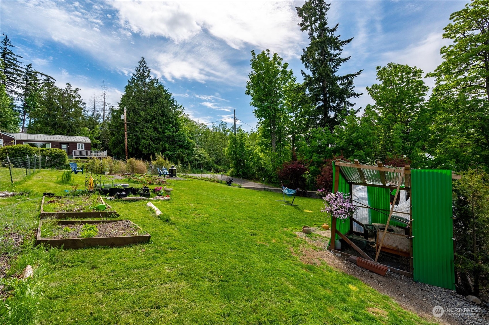 3703 Fielding Avenue Bellingham, WA 98229 - Photo 33 of 40 a view of a backyard with couches chairs and a table and chairs