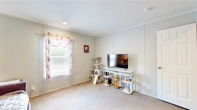 a view of a livingroom with a flat screen tv