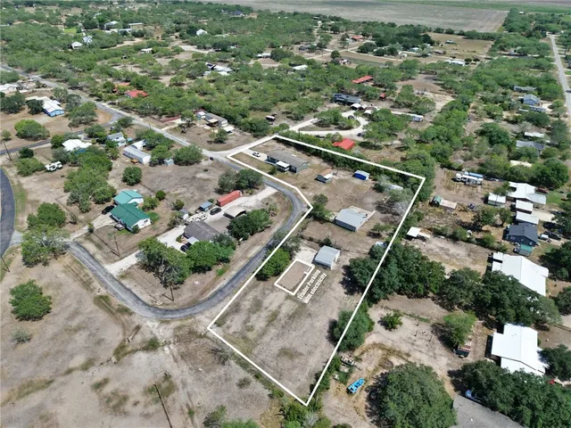 a aerial view of a house with a yard