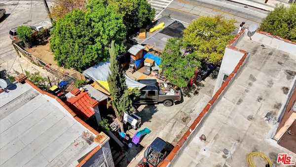 an aerial view of a house with outdoor space