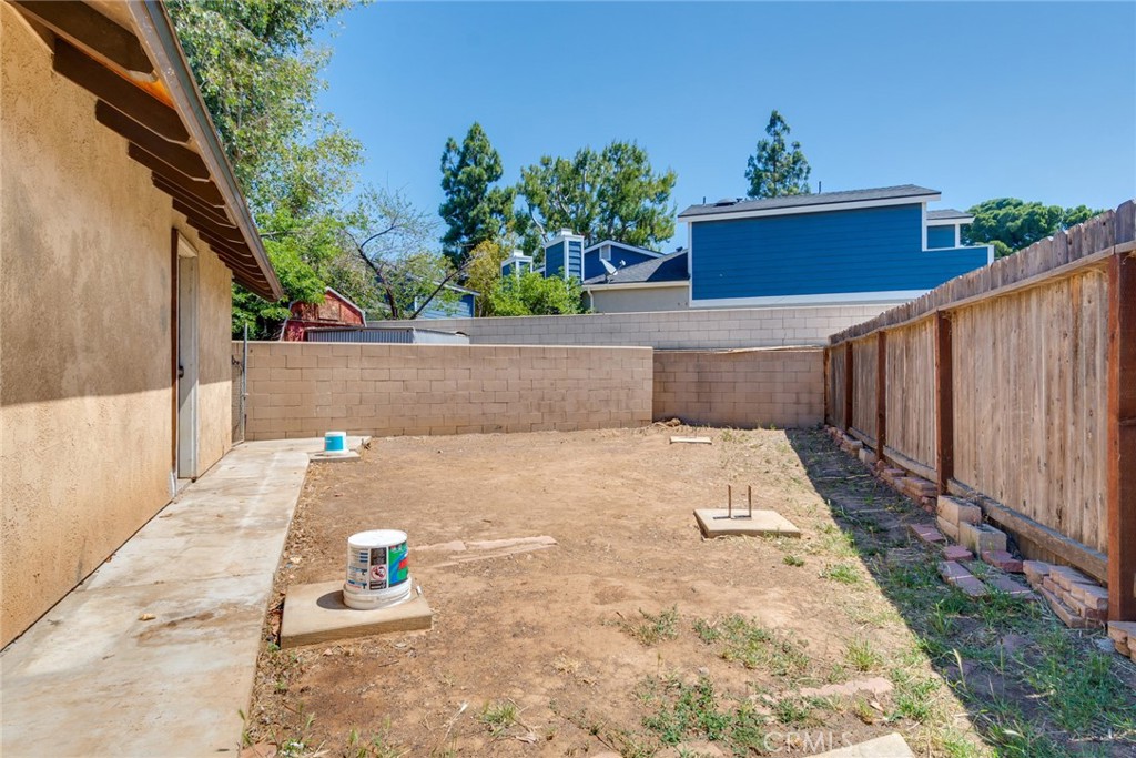 9130 Duncan Avenue Riverside, CA 92503 - Photo 31 of 34 Rear yard behind workshop with footings for a cover.
