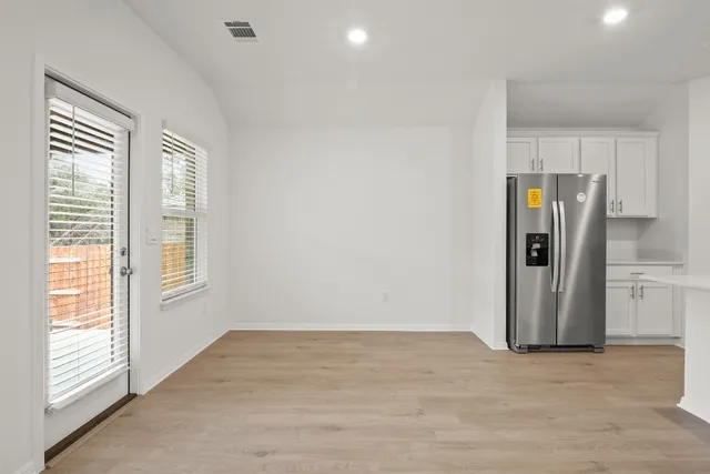 a stove top oven sitting inside of a kitchen