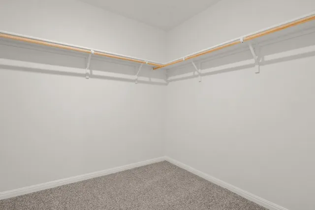 a bathroom with a double vanity sink and mirror