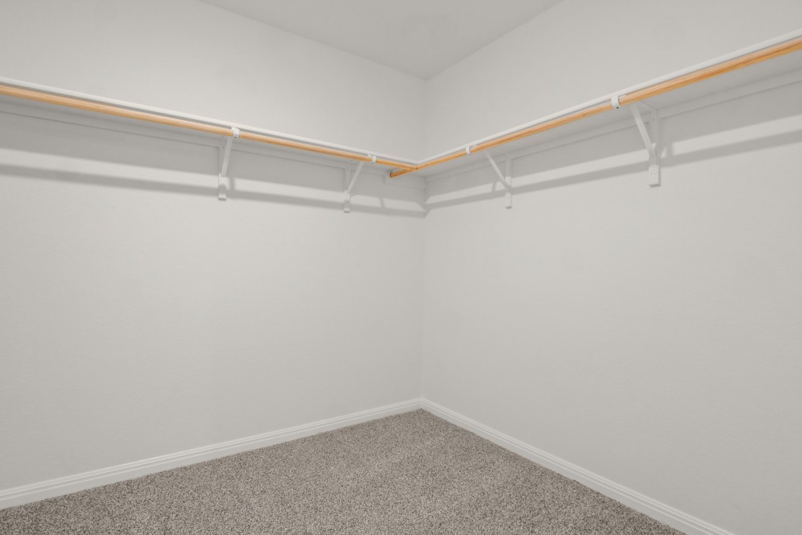 2408 Bronc Buster Way Leander, TX 78641 - Photo 17 of 24 a view of a room with racks on the wall