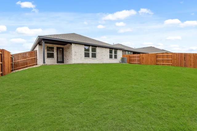 a front view of a house with yard