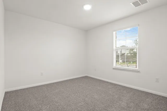 a kitchen with a sink a stove a refrigerator a microwave and cabinets