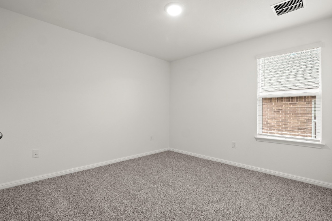 2408 Bronc Buster Way Leander, TX 78641 - Photo 8 of 24 an empty room with a window