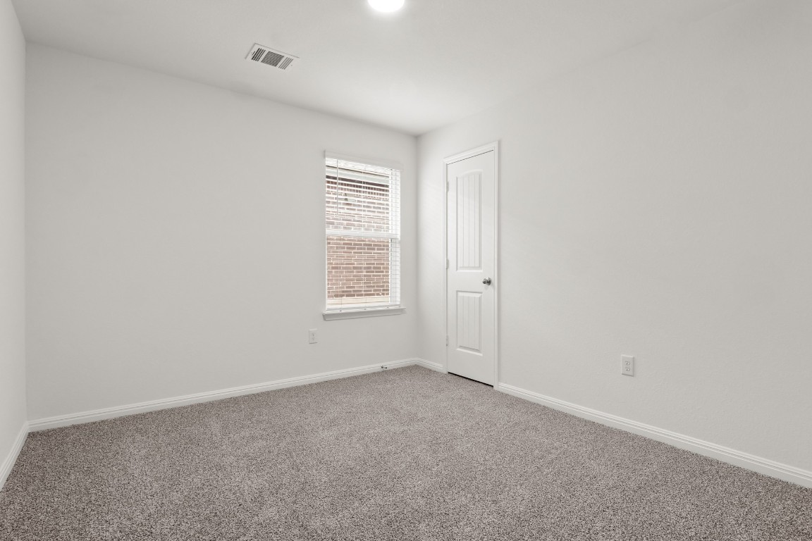2408 Bronc Buster Way Leander, TX 78641 - Photo 9 of 24 an empty room with windows