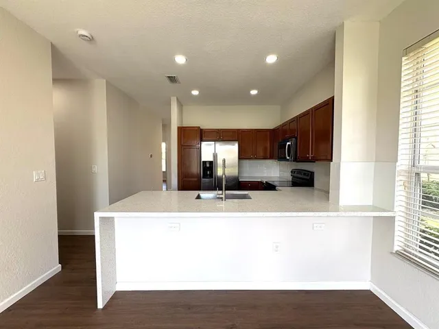 a view of kitchen with wooden floor