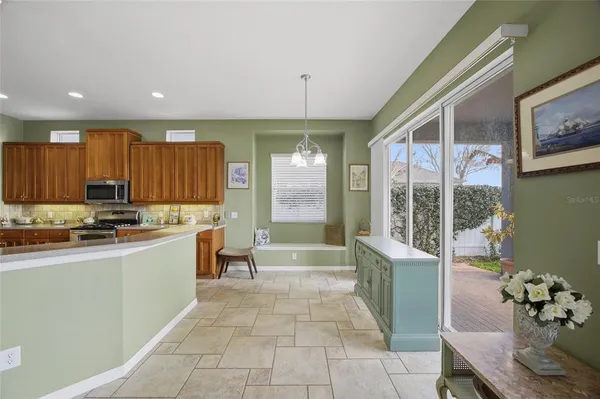 a view of a hallway with paintings on the wall