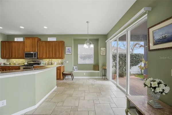an empty room with closet and a chandelier fan