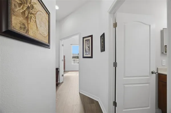 an empty room with closet and a chandelier fan