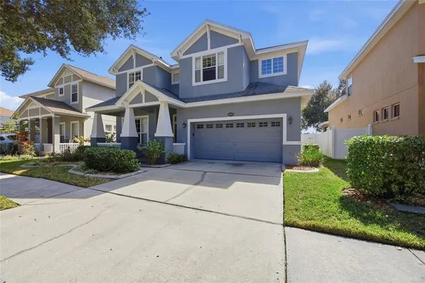a view of a livingroom with wooden floor and a rug