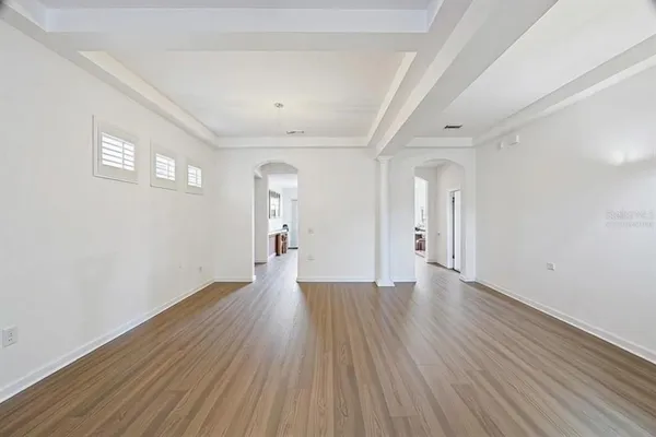 a view of a livingroom with furniture and wooden floor