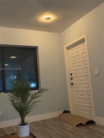 a potted plant sitting on top of a wooden floor