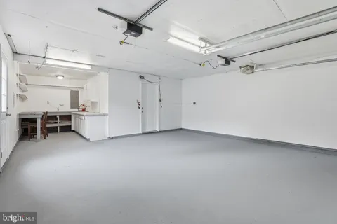 a view of a livingroom with furniture and a window