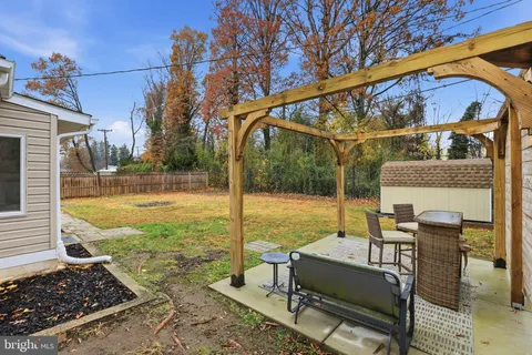 a view of a porch with furniture and yard