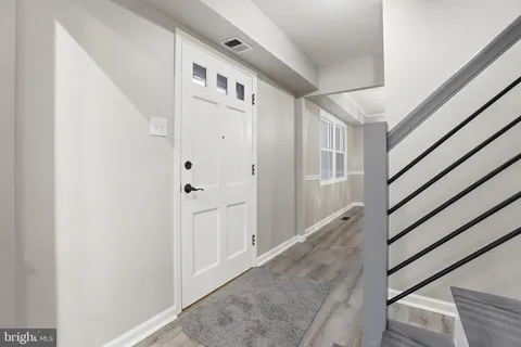 a view of entryway with a front door